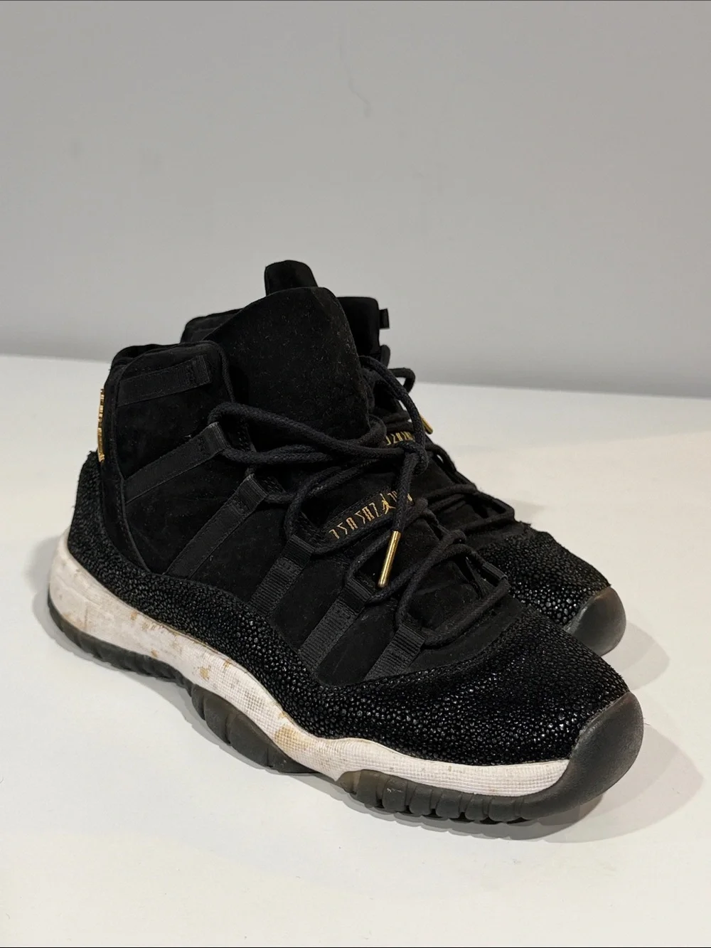 Jordan Black and Gold High-Top Sneakers